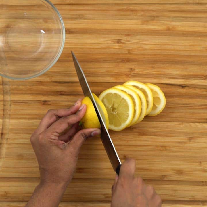 Cutting lemon into slices