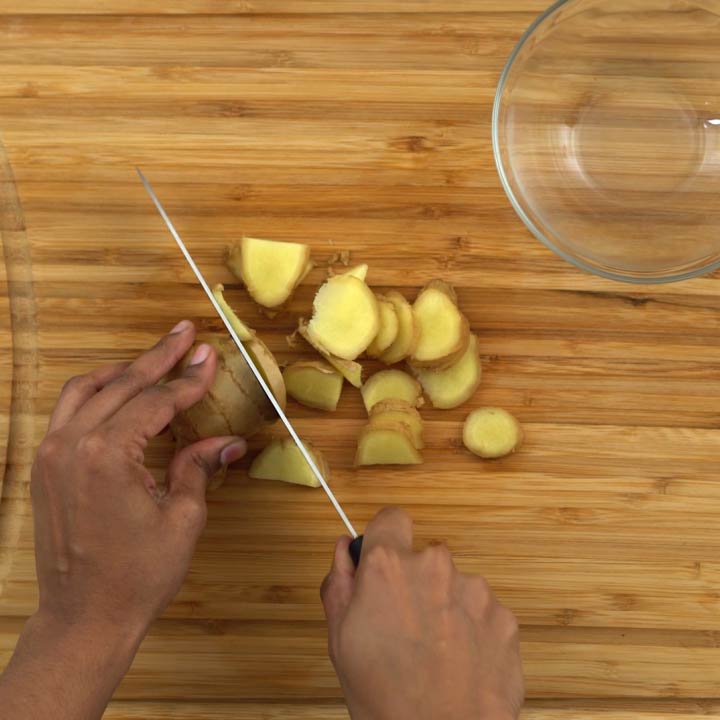Cutting ginger in to pieces