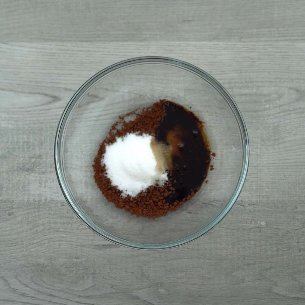 coffee powder, sugar and water in a glass bowl