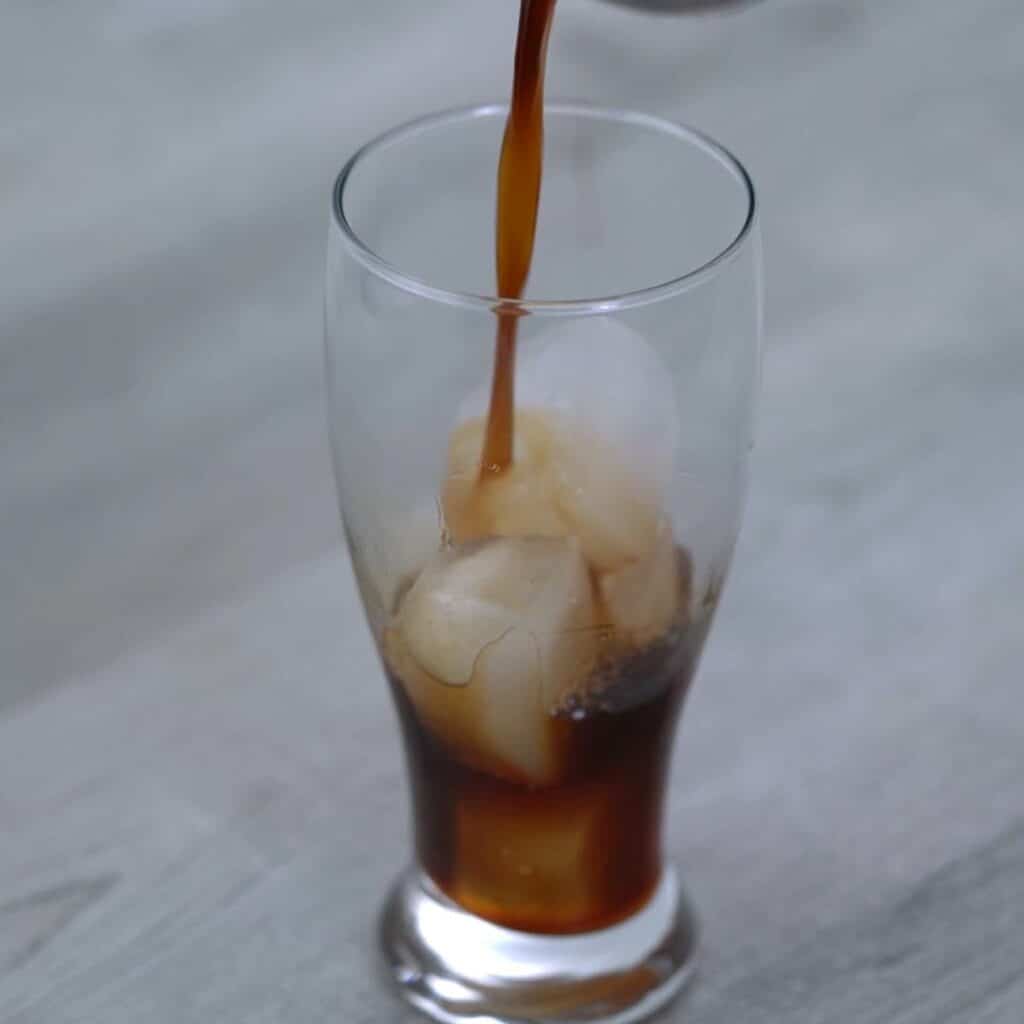 pouring chilled coffee over ice