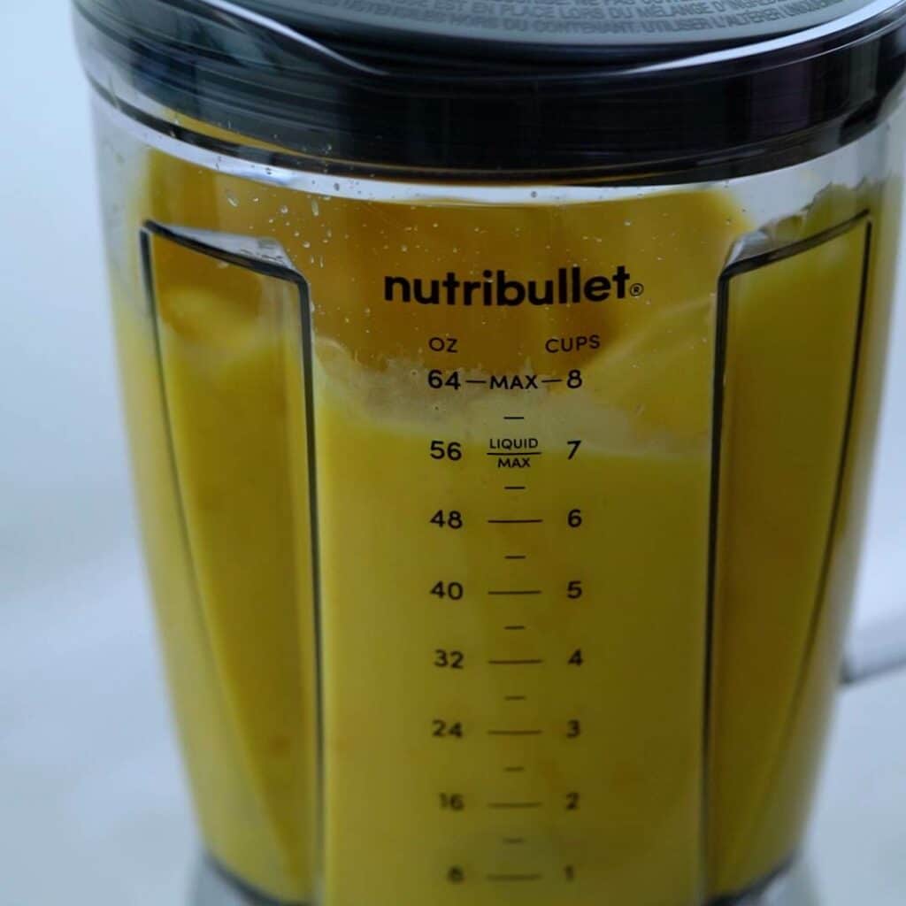 mango juice is blending in blender