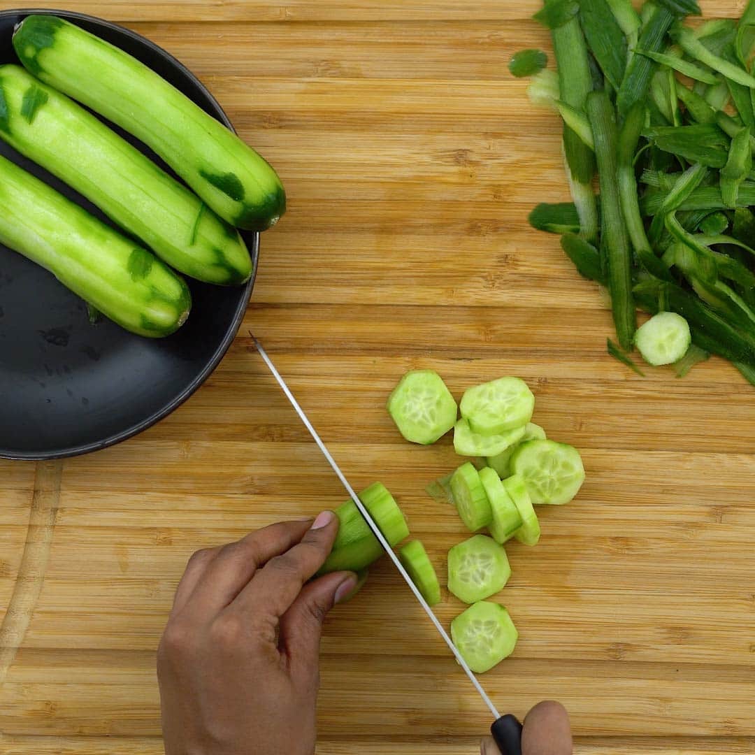chopping the peeled cucumber