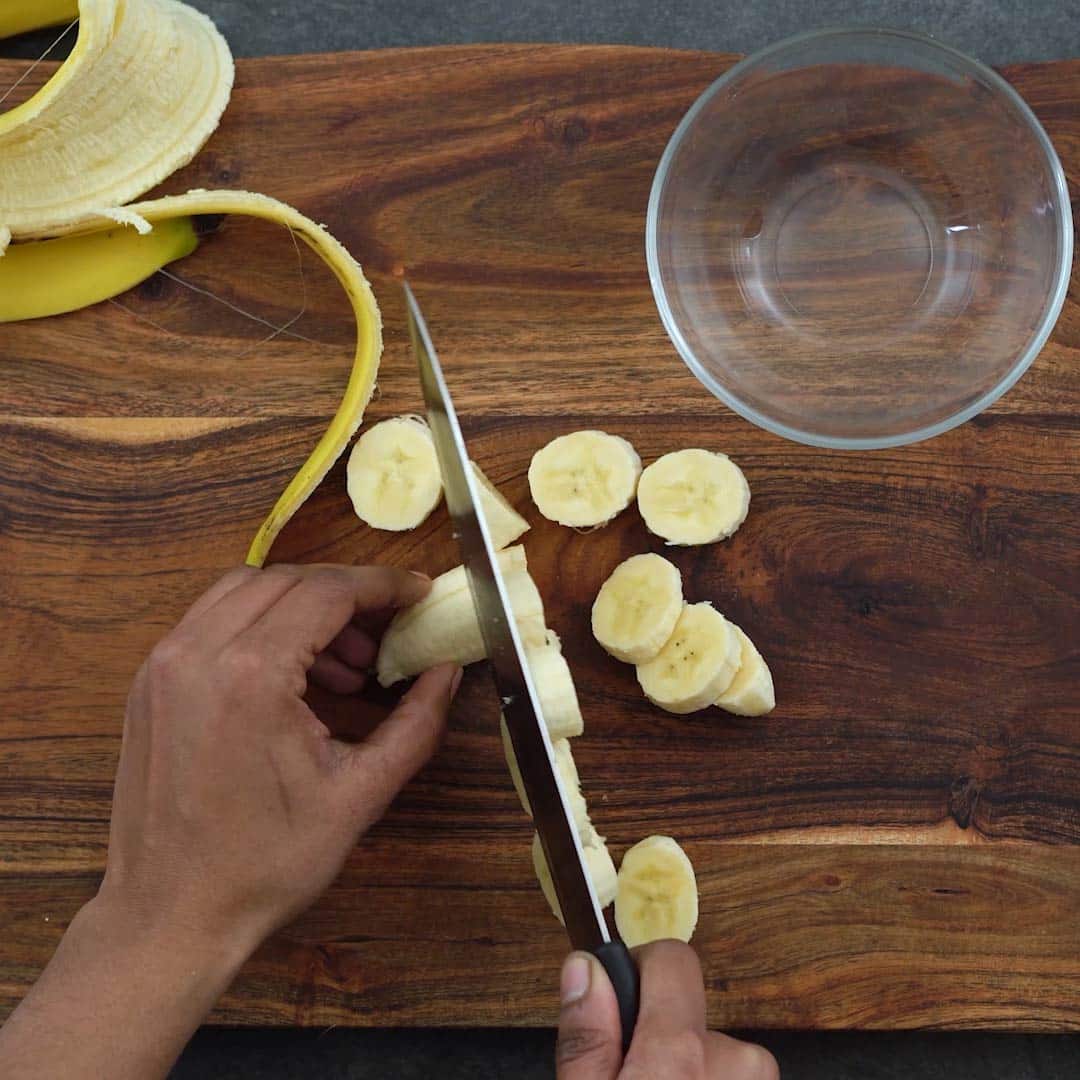 chopping banana into small pieces