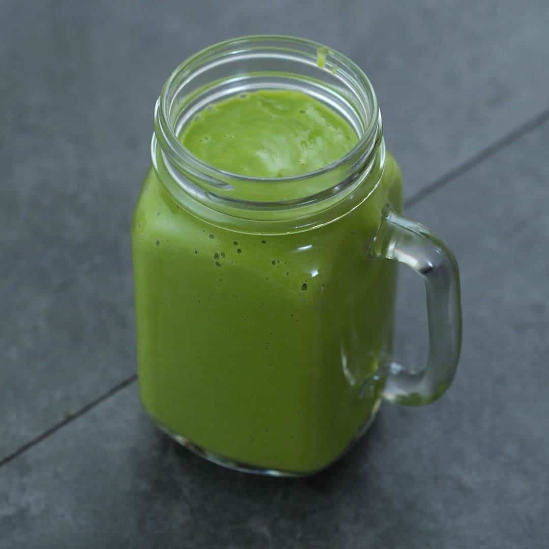healthy avocado smoothie in the serving jar