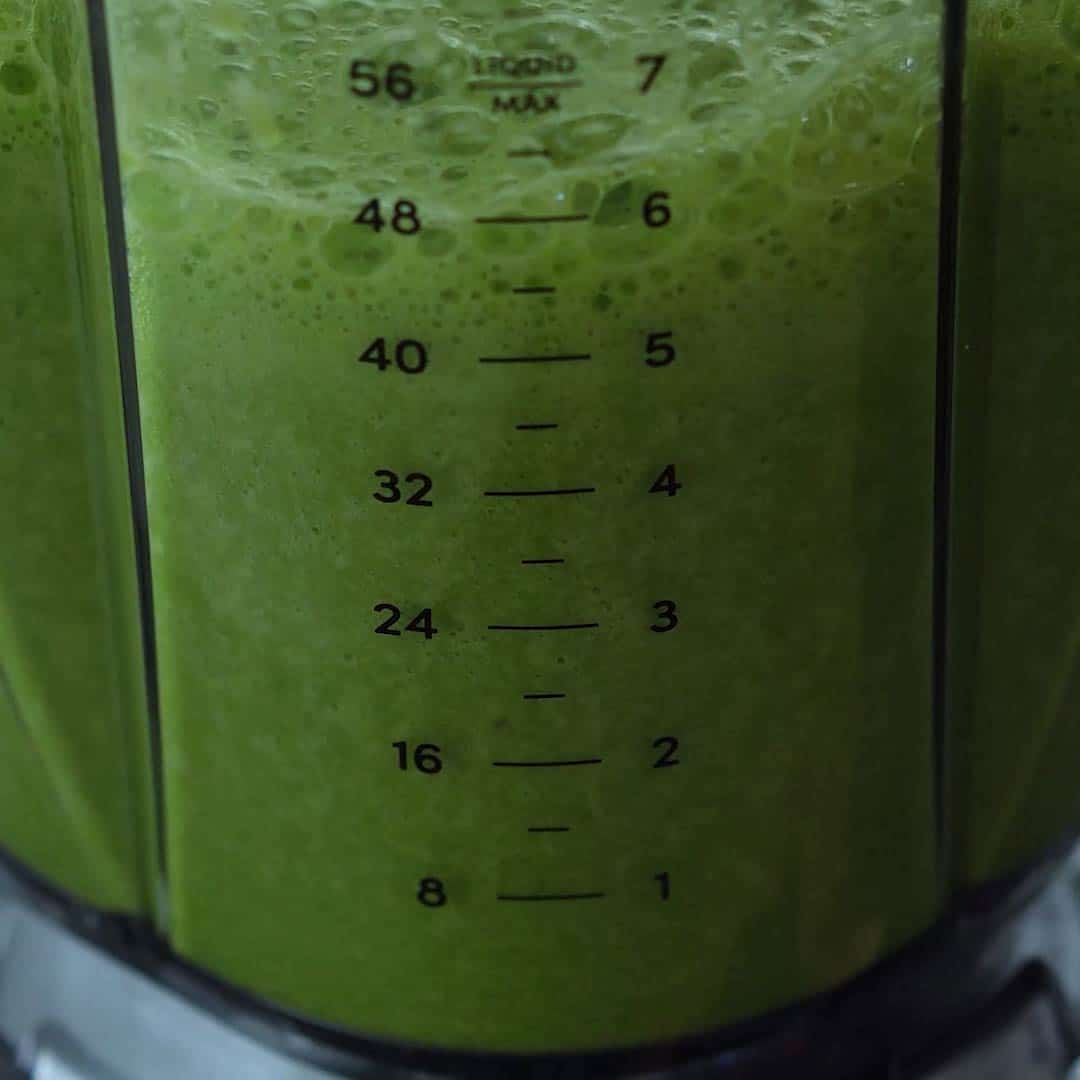 Blended green juice in blender