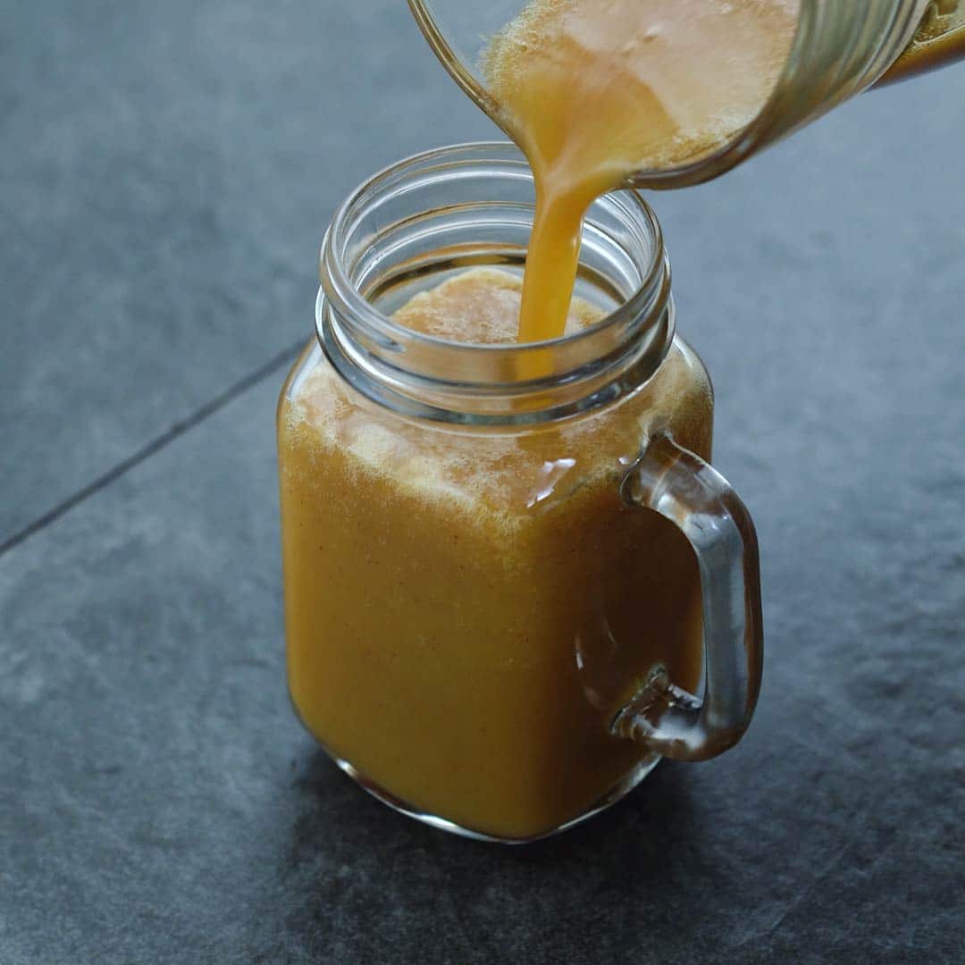 Pouring Apple Juice into a serving mug