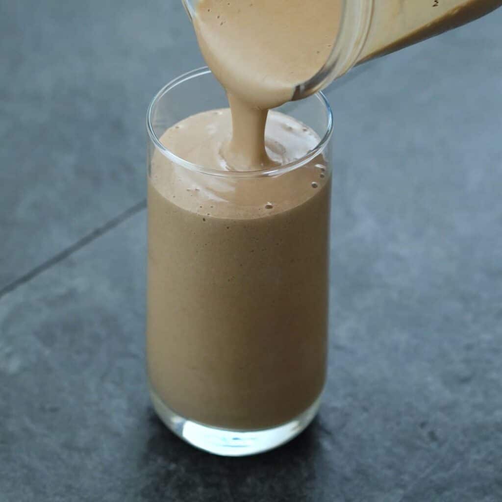 Pouring Protein Smoothie into a serving glass