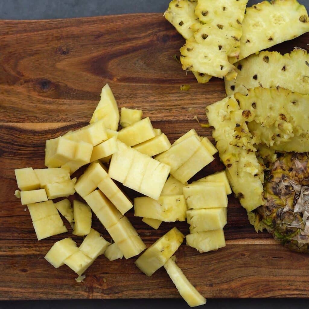 Chopped pineapple in a board