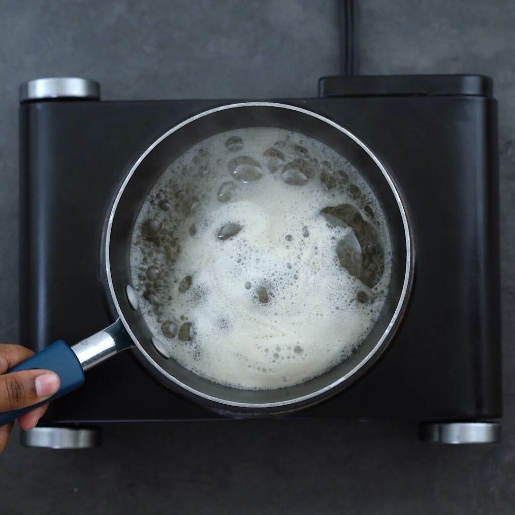 Sugar syrup boiling in a saucepan