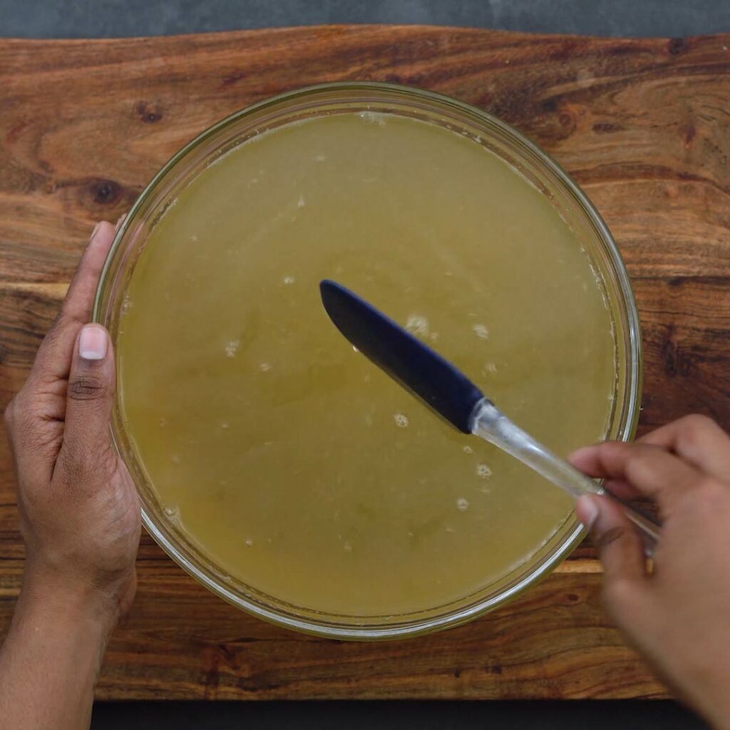 Mixing the lemonade in a bowl with spatula