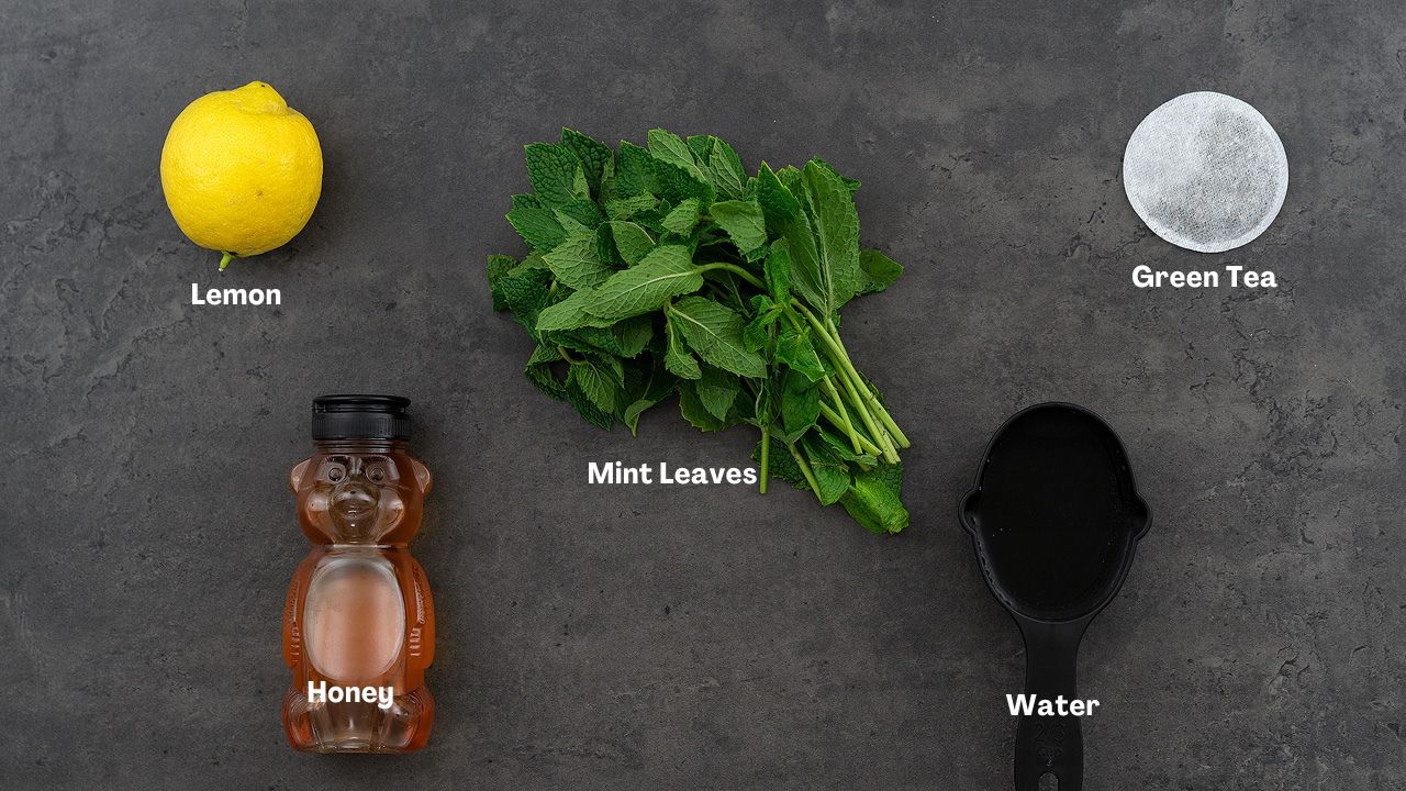 Mint tea recipe ingredients place on a grey table