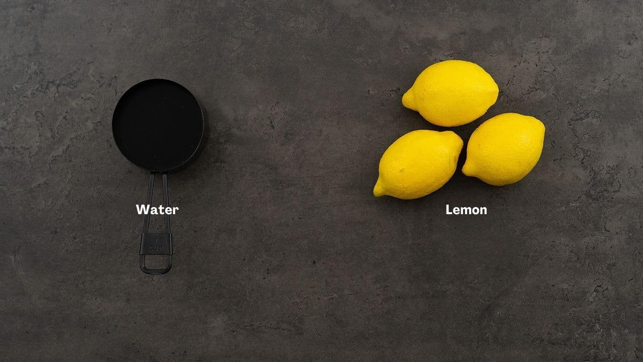 Lemon water ingredients on a grey table