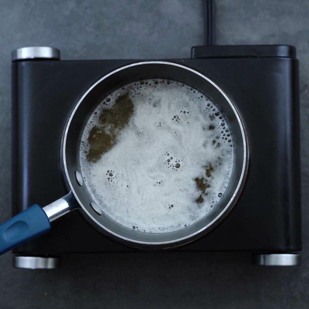Sugar water boiling in a saucepan