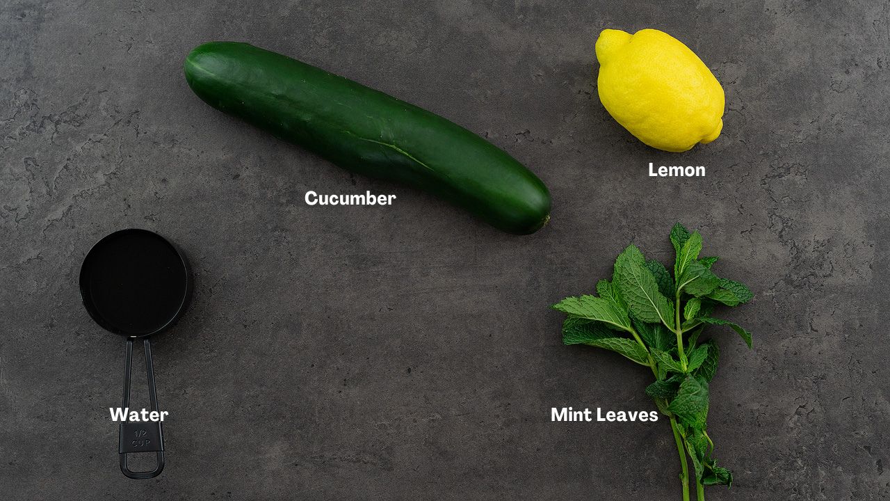 Cucumber Water recipe ingredients placed on a gray table